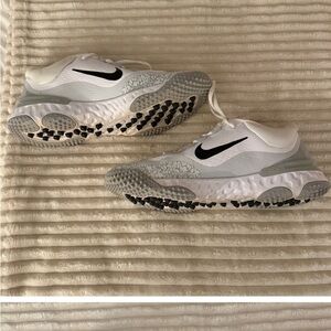 White and Gray Athletic Sneakers with Black Swoosh